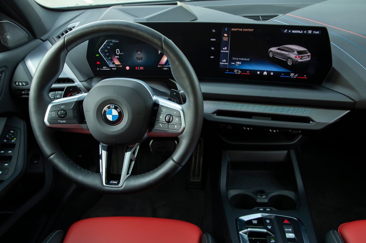 BMW interior with the roundel on the steering wheel